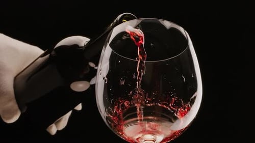 Pouring Red Wine into a Glass