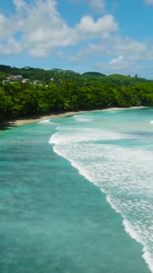 Turquoise Waves Along a Scenic Coast with Lush Greenery Seychelles Mahe