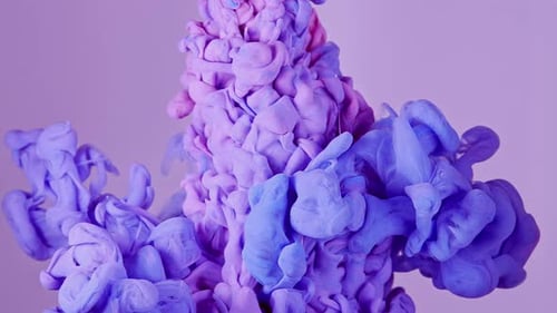 Abstract Swirling Clouds of Pink and Blue Ink