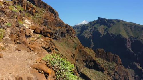 Aerial Flying Over Rocky Canyon Cliff