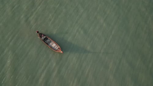 Aerial View of Wooden Boats in a Clear Turquoise Lagoon Near Thailand