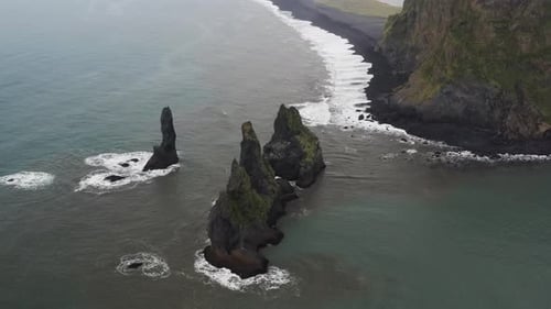 Aerial view of rock formation along the coastline in Iceland.