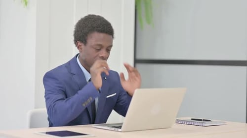 Young Adult at Computer Has Headache