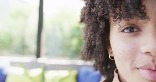 Smiling Young Woman With Curly Hair Close Up