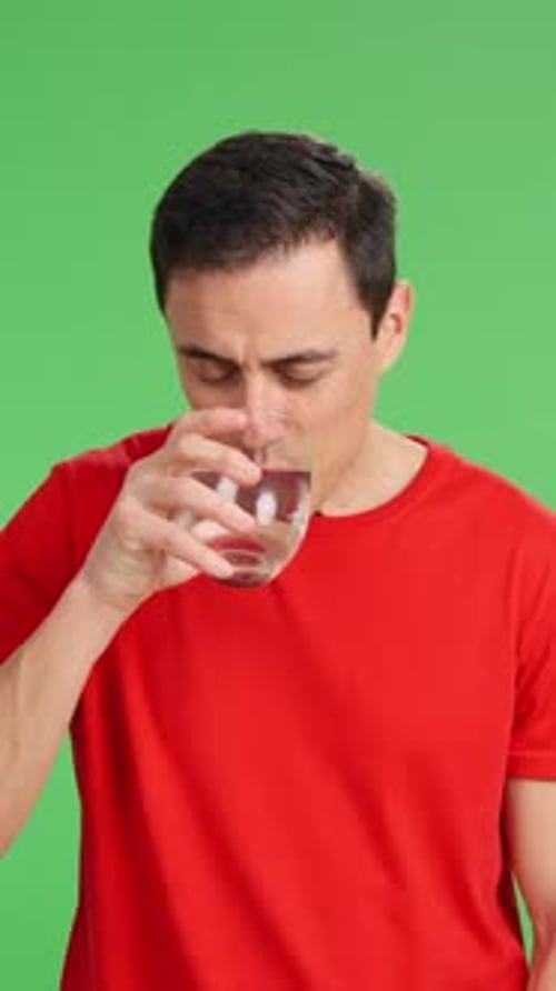 Man Drinking Water in Various Expressions on Green Screen