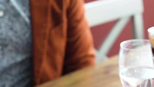 People Toasting with Alcoholic Shot Glasses