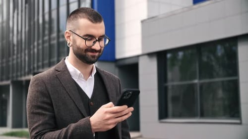 Smiling Business Man in Suit Chatting Use Smartphone Outdoor Downtown Office City Building Closeup