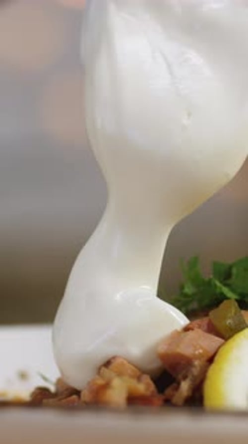 Closeup of Some Person's Hand Adding Sour Cream at the Bowl with Solyanka Stock Footage Russian