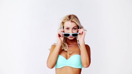 People, Fashion, Swimwear, Summer And Beach Concept - Happy Young Woman With Sunglasses Posing In...