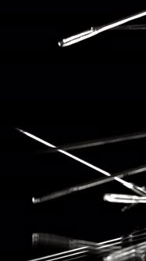 Sewing Needles Fall on the Table Filmed on a Highspeed Camera at 1000 Fps
