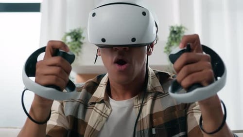 Man Immersed in Virtual Reality Gaming at Home