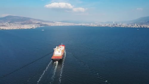 Cargo Container Ship Underway in Calm Sea to Cargo Port for Loading