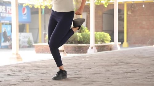 Young Adult Leg Workout in Urban Setting