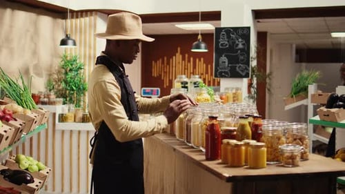 African American Seller Preparing Local Farmers Market Products