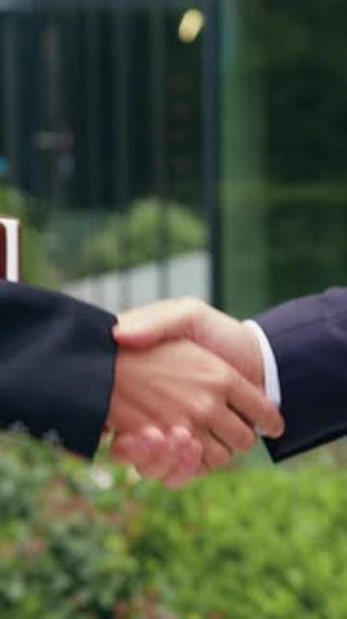 Business Handshake Agreement in Urban Workplace Setting