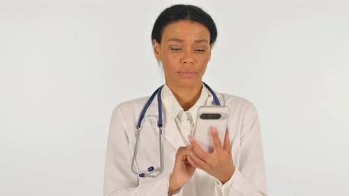 Doctor Using Smartphone in Clean Medical Setting