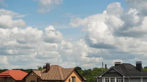 Fast Moving Clouds Over Suburban Rooftops Time Lapse