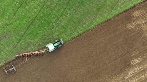 Aerial view of tractor ploughing in Brandenburg, Germany.
