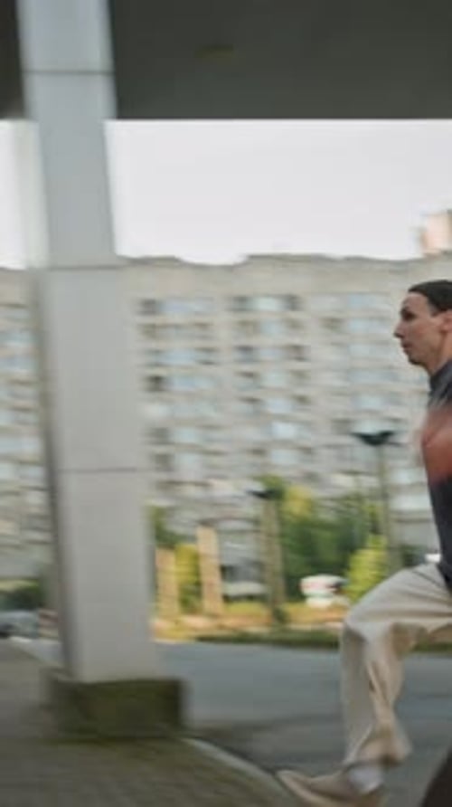 Two men doing parkour in an urban setting