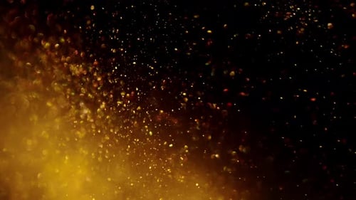 Goldener Glanz und Bokeh in Zeitlupe auf dunklem Hintergrund