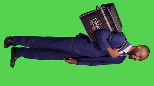 Vertical Video Side View of Young Deliveryman in Suit Giving Fast Food Order