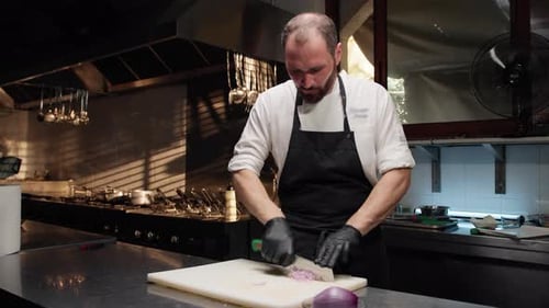 Chef Dices Onion in Commercial Kitchen