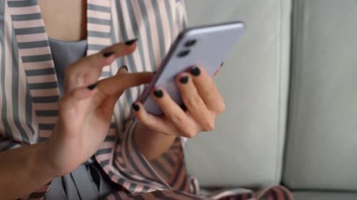 Girl Holding Smartphone Shopping Online. Hands Touching Gadget at Home Closeup. Unknown