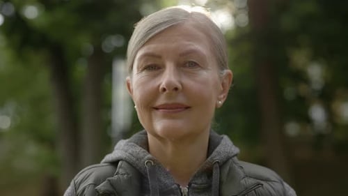 Portrait of the Beautiful Smiled Mature Woman Looking at the Camera Before the Training