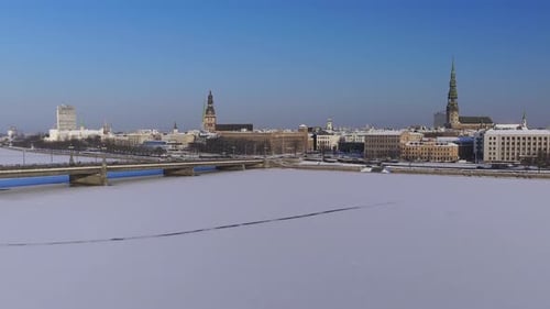 Aerial Winter Over Frozen Daugava River and Riga Old Town Spires