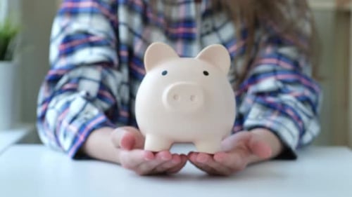 Kid Girl Holding Big Piggy Bank Child with Money Box at Home
