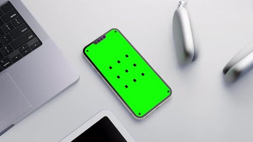 Modern Tech Gadgets with Green Screen Smartphone
