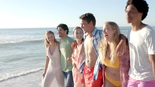 Diverse group of friends enjoy a day at the beach