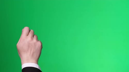 Male Hand Knocking on the Door on a Green Chromakey Background