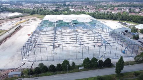 Construction industry metal iron girder warehouse framework construction site aerial view upwards ti