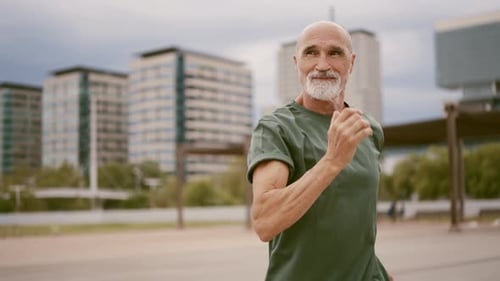 Senior Man Jogging in Urban Setting