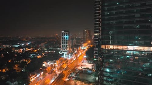Brightly Lit City at Night Aerial View