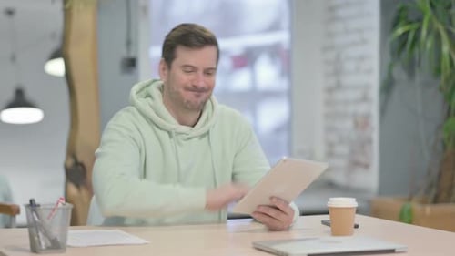 Man Using Tablet is Upset and Disappointed