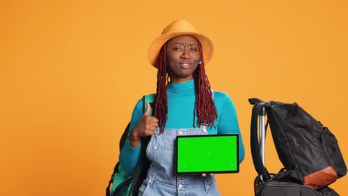 Smiling Adult with Greenscreen on Tablet