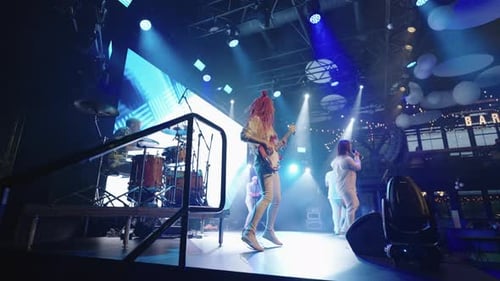 Musical Band Performing Live on Stage at Night