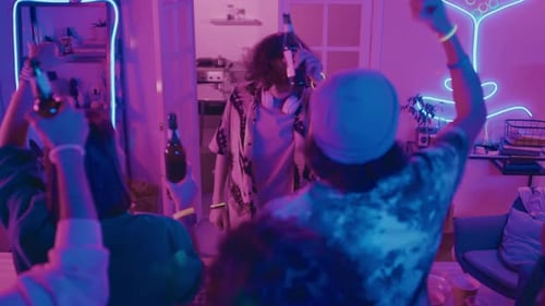 Male DJ Playing and Dancing at House Party