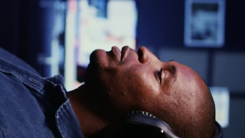 Vertical Video Man Doing Podcasting Session with Professional Streaming Sound Gear Panning Shot