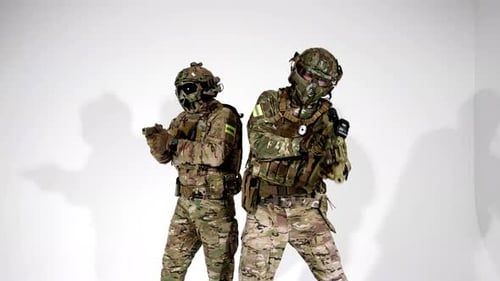 Two Russian Soldiers with Guns in White Background in Studio Warriors in Modern Military Uniform