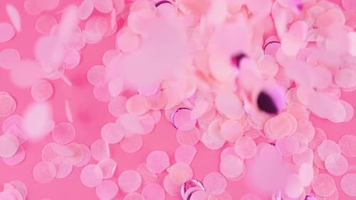 Pink Confetti Falling on Pink Background