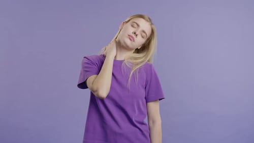 Young Woman Massaging Neck Muscles for Health