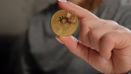 Hand Holding Gold Bitcoin Crypto Currency