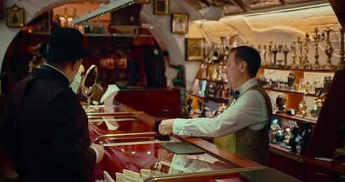 Man Buying Expensive Gold Pocket Watch in Antique Store in 19 Century Prores