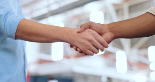 Handshake, partnership and b2b with a business man shaking hands with a colleague in the office
