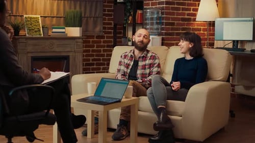 Couple Speaks with Therapist in Comfortable Office