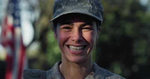 Close Up Slow Motion Portrait of Young Female Patriotic Soldier Standing in Front of the American