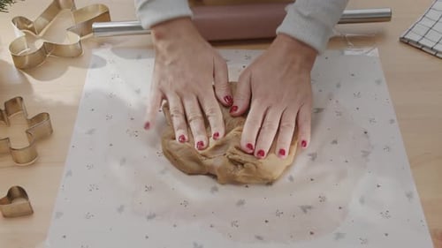 Woman's Hands Kneading Dough for Festive Baking